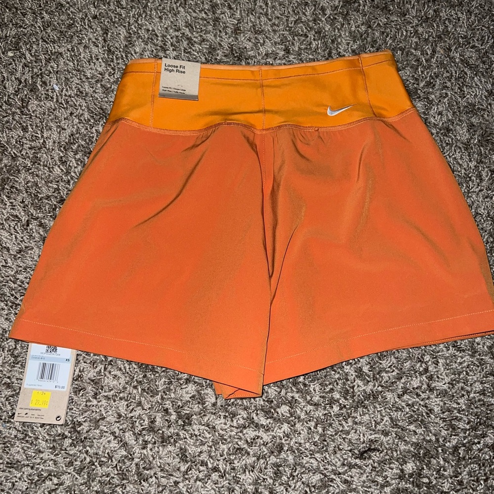 Burnt orange color. Nike shorts. Brand new with tags never worn.